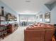 Comfortable living room with carpet, entertainment center, and plenty of space to relax at 14209 Quintessa Ln, Lithia, FL 33547