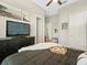 Comfortable bedroom with black furniture, a ceiling fan, and a cozy aesthetic at 14209 Quintessa Ln, Lithia, FL 33547