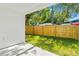 A backyard with green grass and a wood fence providing privacy at 1432 19Th S St, St Petersburg, FL 33712