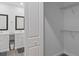 Bright bathroom with double vanities, and a view into the walk-in closet featuring wire shelving at 1432 19Th S St, St Petersburg, FL 33712