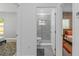 Bathroom between bedrooms showcasing a glass-enclosed shower with stylish finishes and a modern toilet at 1432 19Th S St, St Petersburg, FL 33712