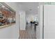 Hallway view shows home's open concept, gray floors, and comfortable living room furniture at 1432 19Th S St, St Petersburg, FL 33712