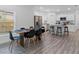 Open kitchen and dining area featuring modern appliances, a dining table, and an island with barstools at 1432 19Th S St, St Petersburg, FL 33712