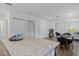 Open concept living room has granite countertops, gray floors, and furniture at 1432 19Th S St, St Petersburg, FL 33712