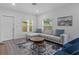 Living room with a comfortable sectional couch, modern decor, and natural light at 1432 19Th S St, St Petersburg, FL 33712