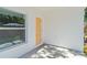 View of the covered patio and rear yard with a yellow door at 1432 19Th S St, St Petersburg, FL 33712