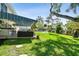Expansive backyard featuring a covered patio, outdoor seating, and a refreshing in-ground swimming pool at 14344 83Rd Pl, Seminole, FL 33776