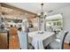 Spacious dining area connected to the kitchen and living room with hardwood floors at 14344 83Rd Pl, Seminole, FL 33776