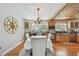 Cozy dining area featuring wood accents, a decorative compass, and an elegant chandelier at 14344 83Rd Pl, Seminole, FL 33776