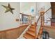 Bright entryway featuring wooden staircase and stained glass window accent at 14344 83Rd Pl, Seminole, FL 33776