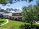 Beautiful two-story home with manicured landscaping and charming details, creating a welcoming curb appeal at 14344 83Rd Pl, Seminole, FL 33776