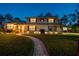Charming two-story home with manicured lawn, stone accents, and inviting pathway at 14344 83Rd Pl, Seminole, FL 33776