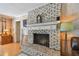 Close up of the white brick fireplace with decorative mantle and accents at 14344 83Rd Pl, Seminole, FL 33776