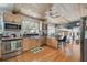 Spacious kitchen with hardwood floors and modern stainless steel appliances at 14344 83Rd Pl, Seminole, FL 33776