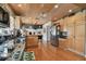 Kitchen features stainless appliances, hardwood floors, and wooden plank ceiling at 14344 83Rd Pl, Seminole, FL 33776
