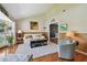 Cozy living room with vaulted ceiling, hardwood floors, and stylish decor at 14344 83Rd Pl, Seminole, FL 33776