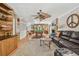 Open living room with fireplace, built-ins, and a view into the game room at 14344 83Rd Pl, Seminole, FL 33776
