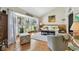 Bright living room with large bay window, hardwood floors, and comfortable seating at 14344 83Rd Pl, Seminole, FL 33776
