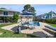 Inviting backyard pool area with brick patio, lounge chairs, and a charming table with umbrella for outdoor relaxation at 14344 83Rd Pl, Seminole, FL 33776