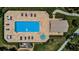 Aerial view showcases community pool, spa, lounge area, and landscaping at 1522 Riverdale Dr, Oldsmar, FL 34677