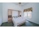 Bedroom showcasing built in storage, a window with a view, and a neutral color palette at 1522 Riverdale Dr, Oldsmar, FL 34677