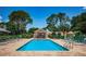 Inviting community pool area with lounge chairs and shaded seating at 1522 Riverdale Dr, Oldsmar, FL 34677