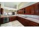Modern kitchen featuring wood cabinets, and stainless steel appliances at 1522 Riverdale Dr, Oldsmar, FL 34677