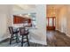 Open-concept kitchen bar and elegant entry featuring hardwood flooring at 1522 Riverdale Dr, Oldsmar, FL 34677