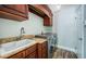Well-equipped laundry room with granite countertops, a utility sink, and modern appliances at 1522 Riverdale Dr, Oldsmar, FL 34677