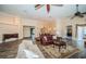 Large, open living space with hardwood floors and a view into the dining area at 1522 Riverdale Dr, Oldsmar, FL 34677