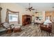 Spacious living room featuring wood flooring, ceiling fans, and an open design at 1522 Riverdale Dr, Oldsmar, FL 34677