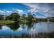 Beautiful view of the pond with a fountain and surrounding homes at 1522 Riverdale Dr, Oldsmar, FL 34677