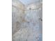 Tiled shower with a built in seat and decorative tile accent at 1522 Riverdale Dr, Oldsmar, FL 34677