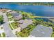 An elevated view overlooking a property near the lake, showcasing landscaping and neighborhood features at 16529 Ivy Lake Dr, Odessa, FL 33556