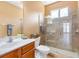 Bathroom featuring a walk-in shower, vanity, and a bright window at 16529 Ivy Lake Dr, Odessa, FL 33556