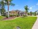 A well-maintained lawn and carefully arranged landscaping enhance the curb appeal of this inviting home at 16529 Ivy Lake Dr, Odessa, FL 33556
