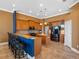 Kitchen showcasing dark stainless steel appliances, a center island, a breakfast bar and granite countertops at 16529 Ivy Lake Dr, Odessa, FL 33556