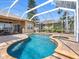 Inviting screened-in pool and spa area, perfect for relaxation and enjoying the Florida sunshine at 16529 Ivy Lake Dr, Odessa, FL 33556