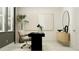 Bright home office featuring a modern black desk, stylish chair, and minimalist decor at 18140 Serene Lake Loop, Lutz, FL 33548