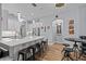 Kitchen island with bar stool seating, pendant lighting, and stainless steel appliances at 19026 Dove Creek Dr, Tampa, FL 33647