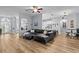 Open-concept living space with views to the kitchen, hardwood floors, and modern furniture at 19026 Dove Creek Dr, Tampa, FL 33647