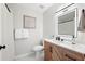 Bathroom features a modern vanity and toilet with a luxurious shower at 2410 26Th S St, St Petersburg, FL 33712