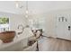 Modern kitchen featuring a breakfast bar, a wooden table, and an exterior door at 2410 26Th S St, St Petersburg, FL 33712