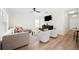 Open-concept living room with lots of light, wood floors and neutral colors at 2410 26Th S St, St Petersburg, FL 33712