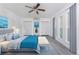 Modern bedroom with sleek furniture, soft bedding, and ample closet space at 24549 Nova Ln, Punta Gorda, FL 33980