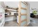 Pantry with open shelving and countertops, sliding barn door, and natural light at 24549 Nova Ln, Punta Gorda, FL 33980