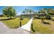 Relaxing pool area with screened enclosure, beautiful landscaping, and walkway at 24549 Nova Ln, Punta Gorda, FL 33980