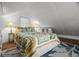 Attic bedroom featuring a pitched ceiling, comfortable bedding, and cozy decor at 2610 58Th S St, Gulfport, FL 33707
