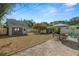 This is a view of the backyard and shed with a seating area and umbrella at 2610 58Th S St, Gulfport, FL 33707