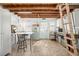 Finished basement with exposed wood beams, versatile space, and a rustic charm at 2610 58Th S St, Gulfport, FL 33707